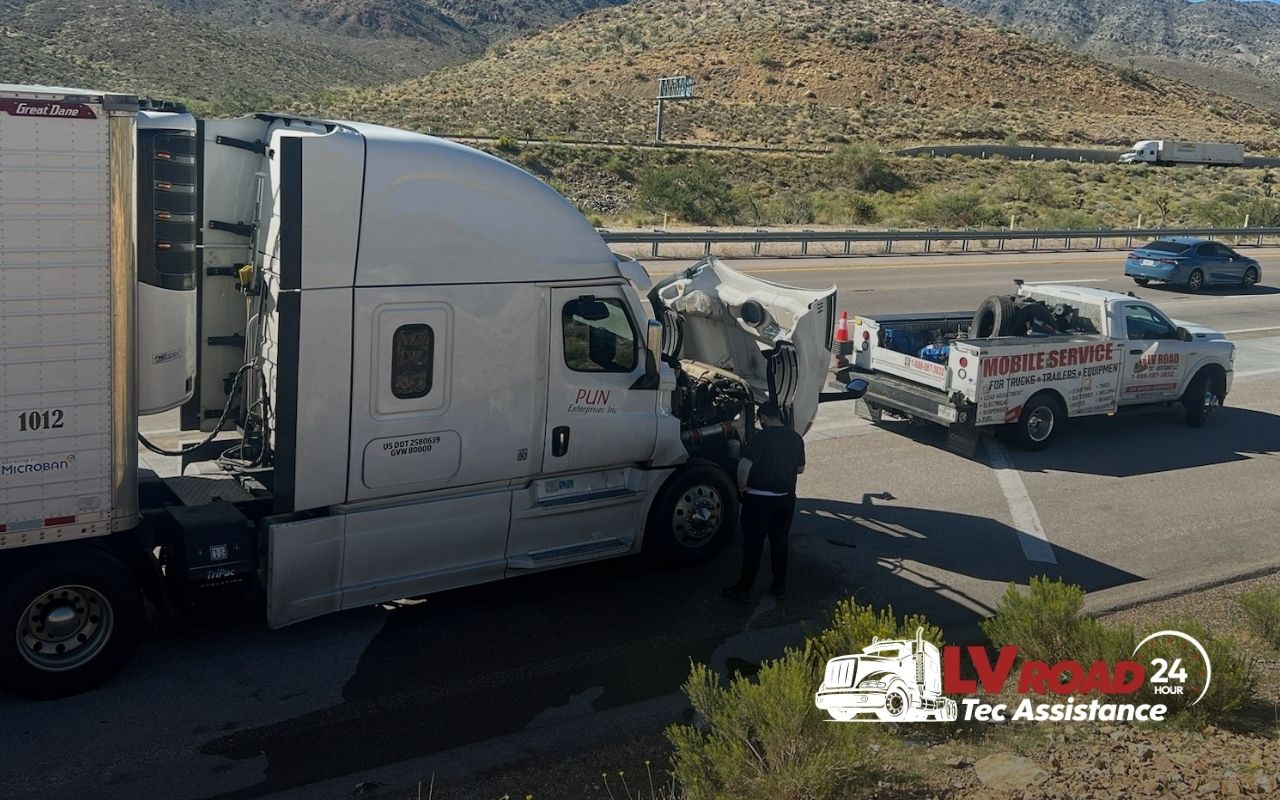 Technician performing emergency roadside repair on semi truck in California